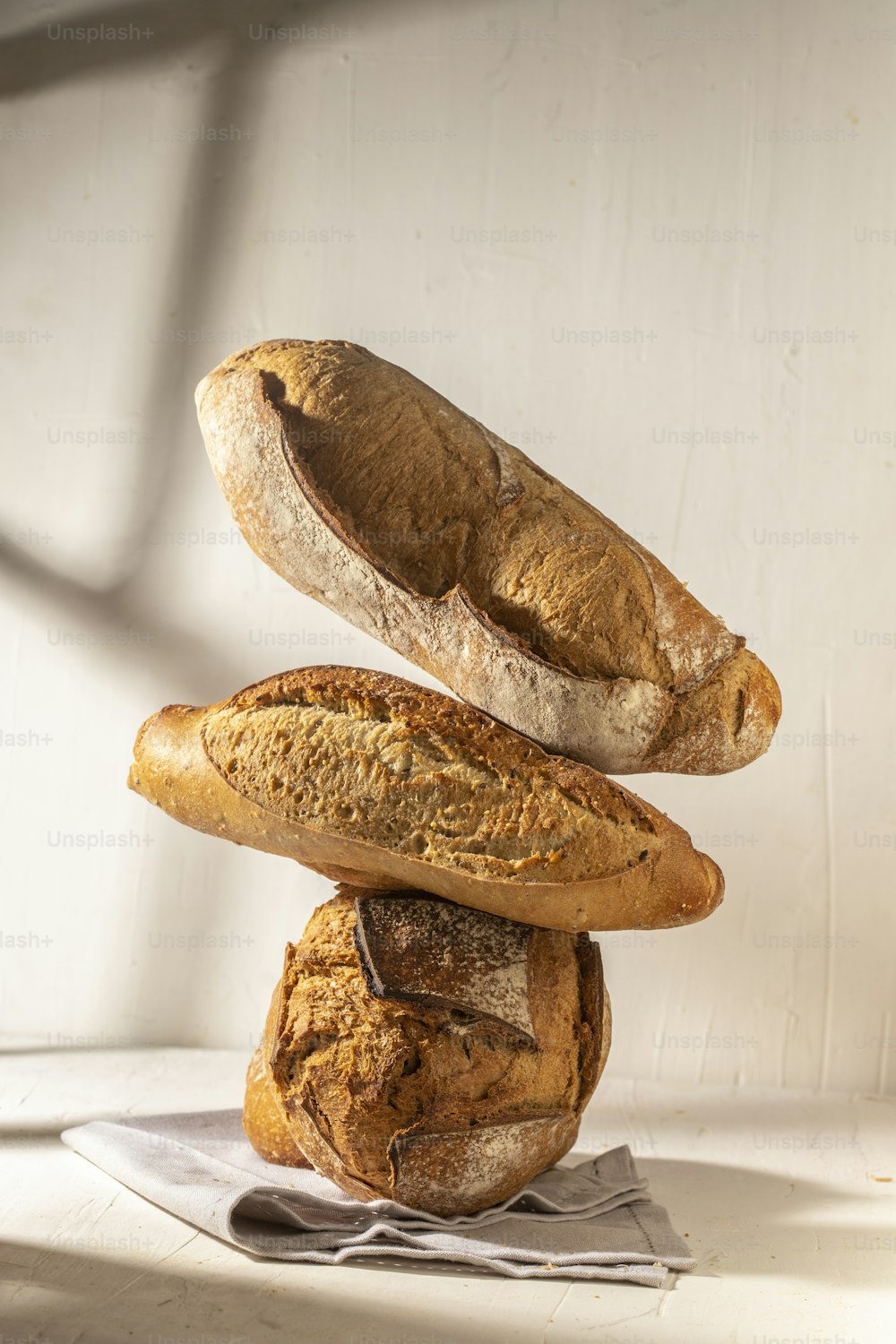 three loaves of bread stacked on top of each other