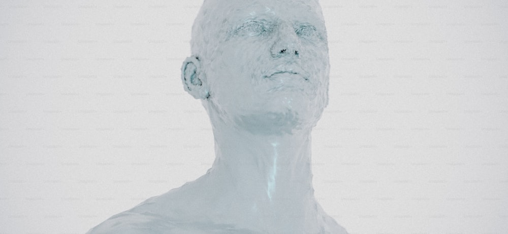 a white sculpture of a man with a bald head