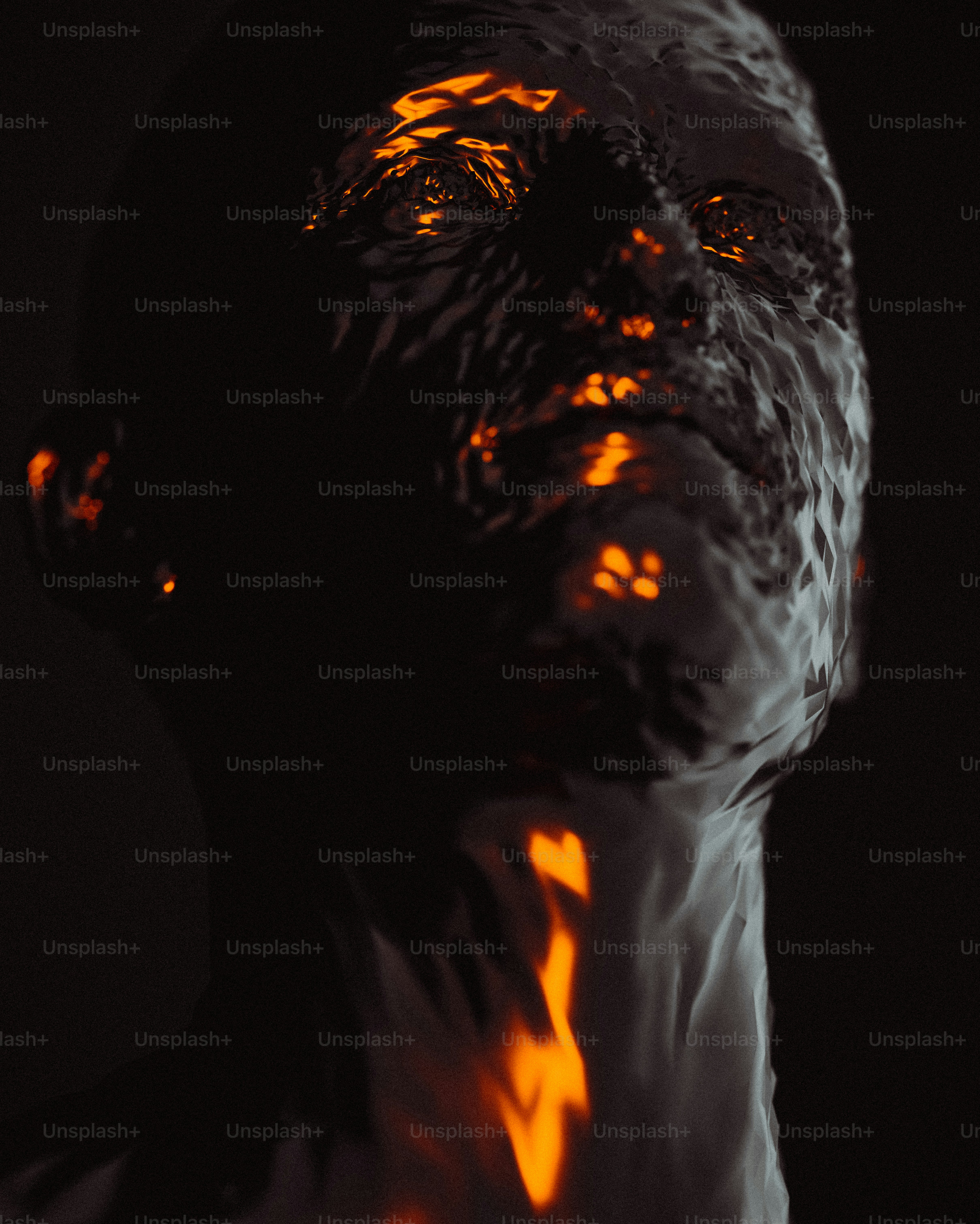 a man's face is lit up with orange light