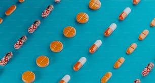 a group of pills sitting on top of a blue surface