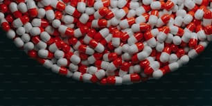 a bowl filled with red and white pills