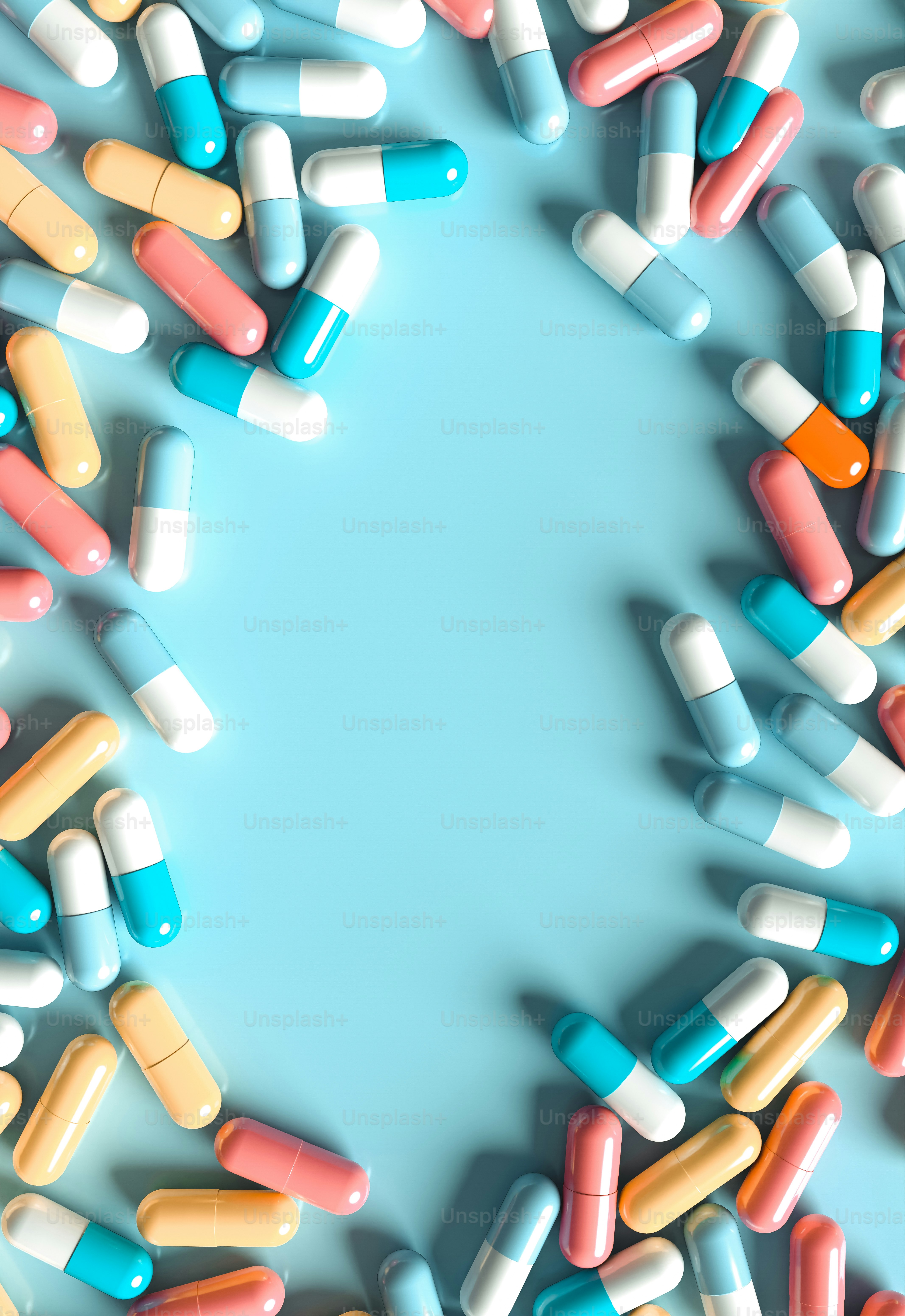 a group of pills sitting on top of a blue surface