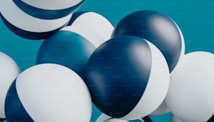 a bunch of blue and white balloons floating in the air