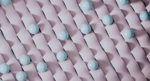 a group of blue candies sitting on top of a pink surface