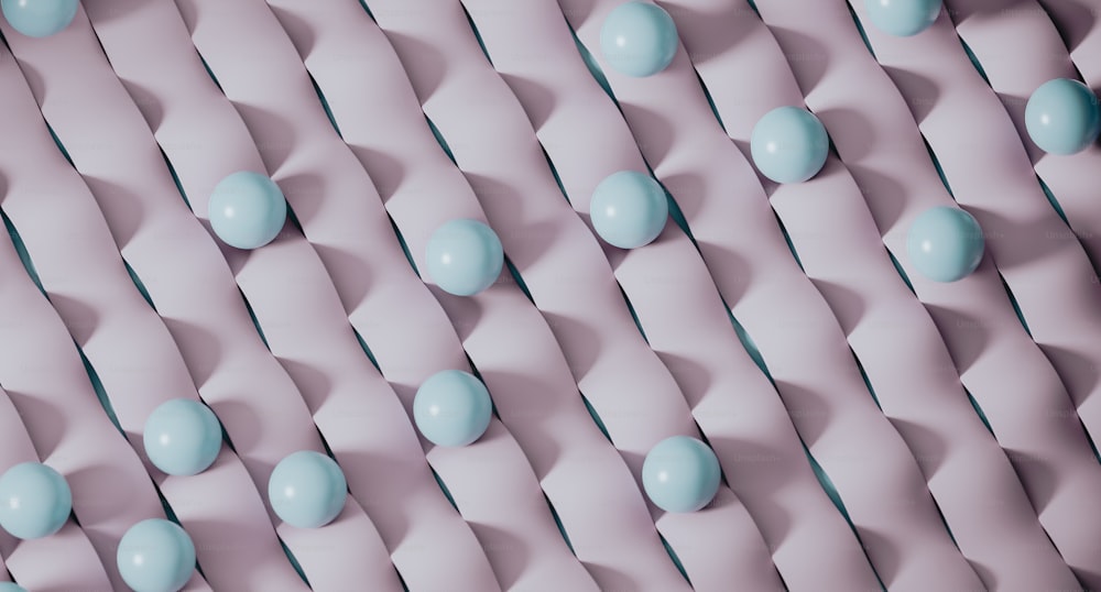 a group of blue candies sitting on top of a pink surface