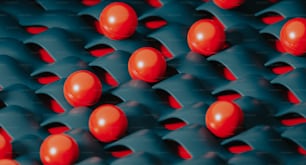 Eine Gruppe roter Kugeln, die auf einer blauen Oberfläche sitzen