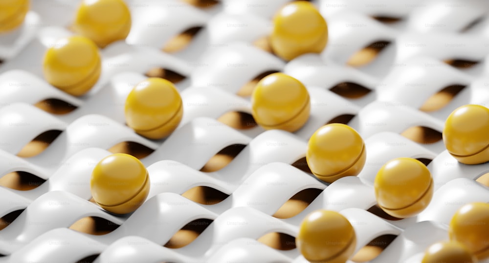 a group of yellow and white balls sitting on top of each other