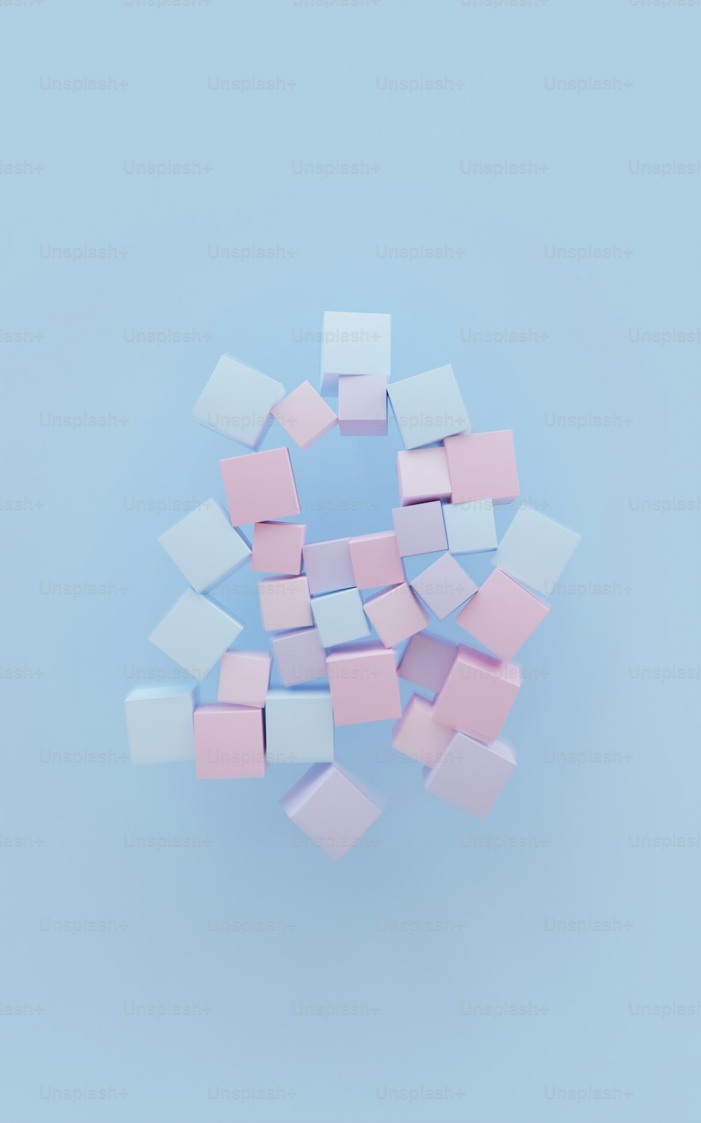 a bunch of small pink and white squares