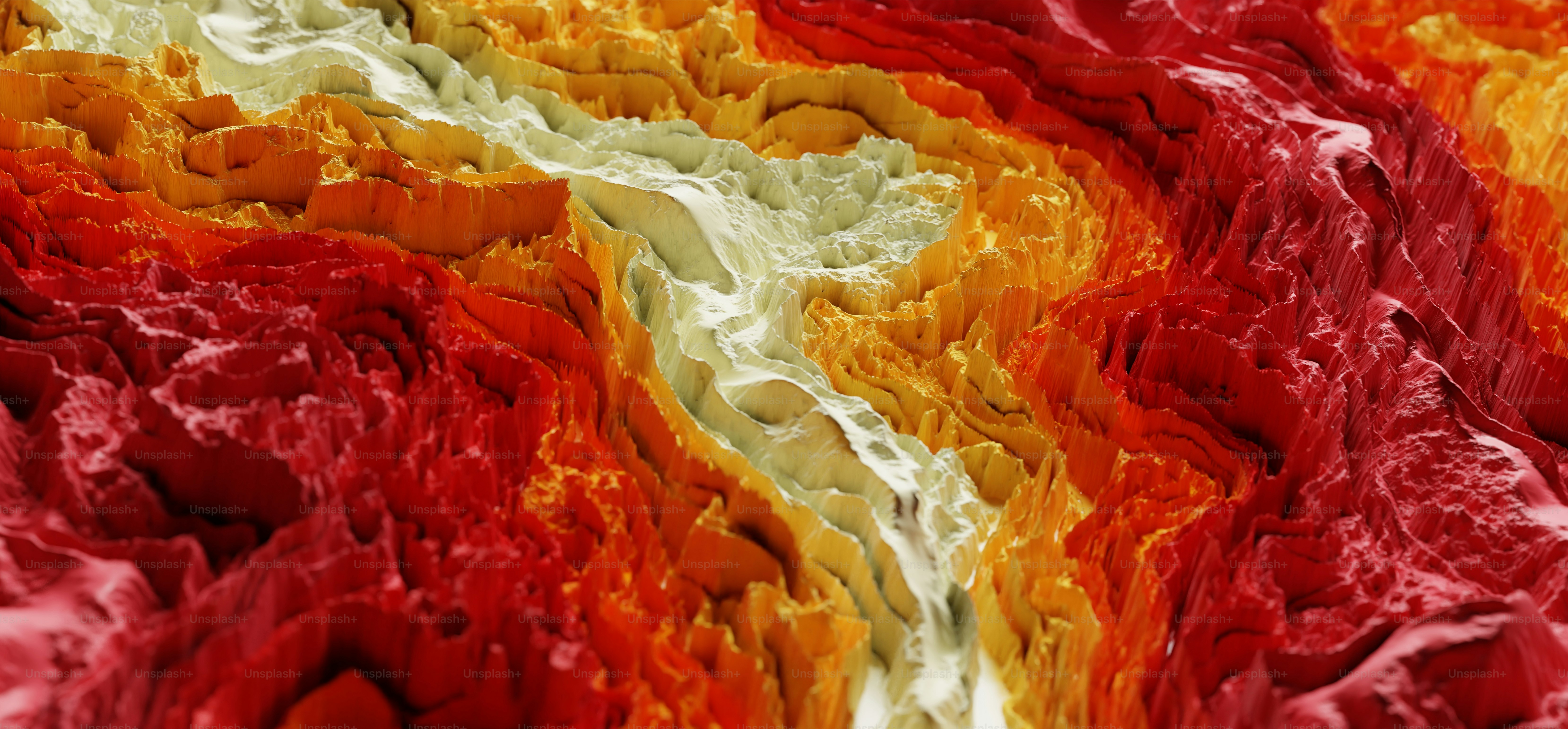 a close up of a red, yellow, and orange abstract painting