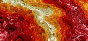 um close up de uma pintura abstrata vermelha, amarela e laranja