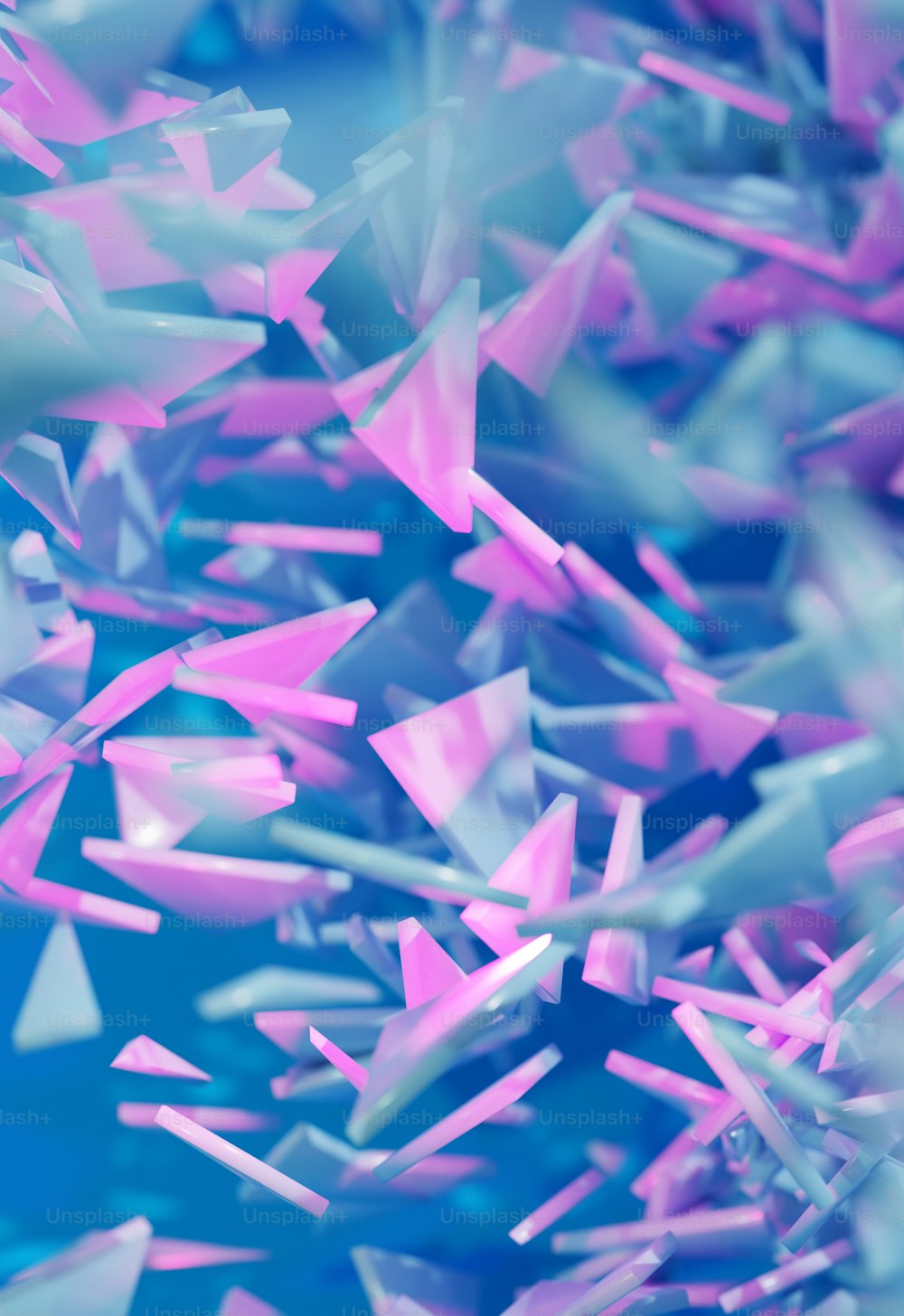 a bunch of pink and blue objects flying in the air