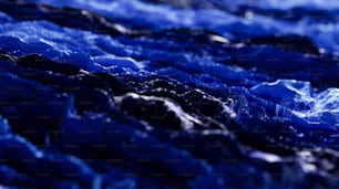 a close up of a blue cloth with water droplets on it