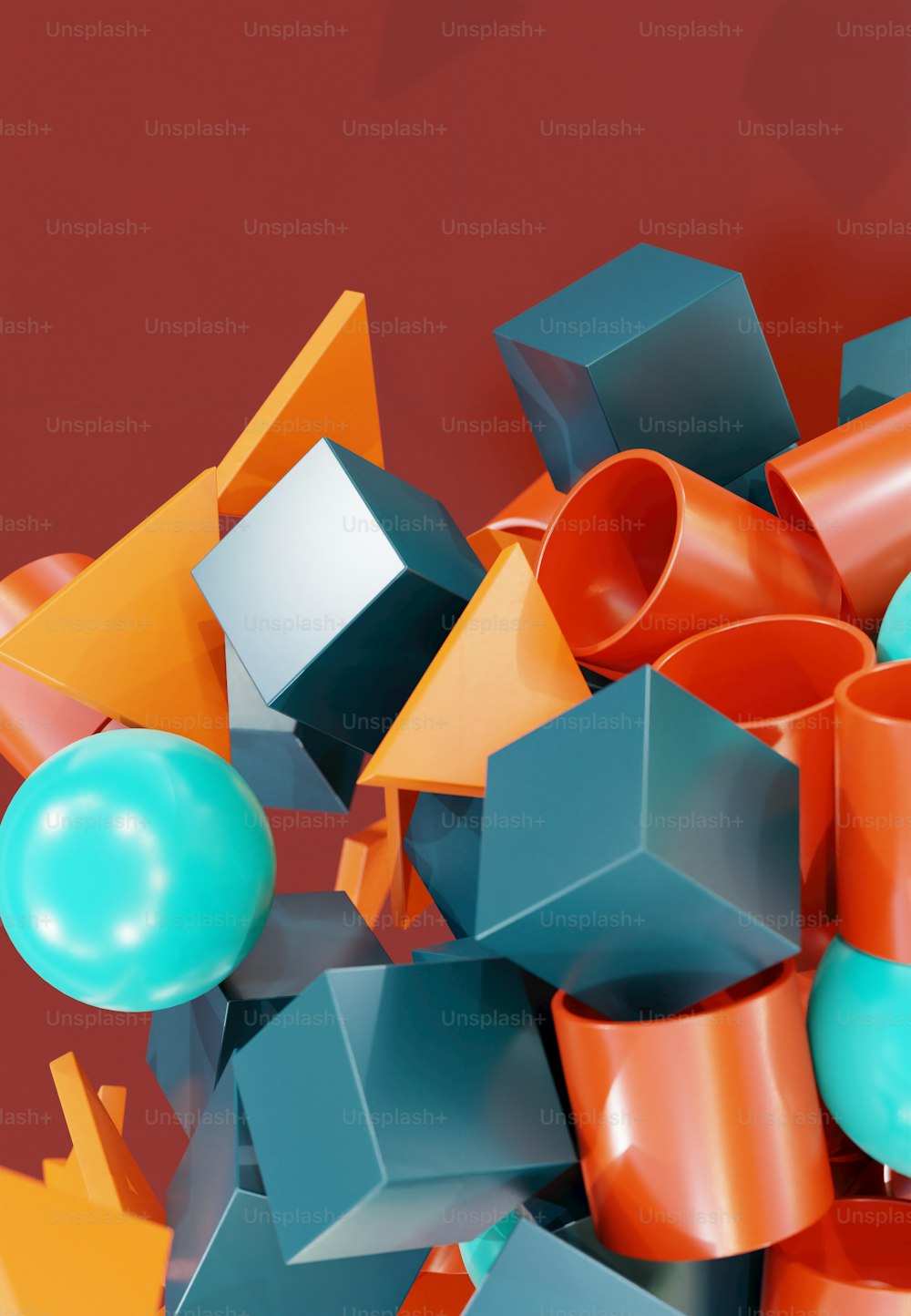 a pile of orange and blue objects on a red background