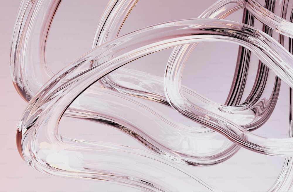 a close up of a glass object on a pink background