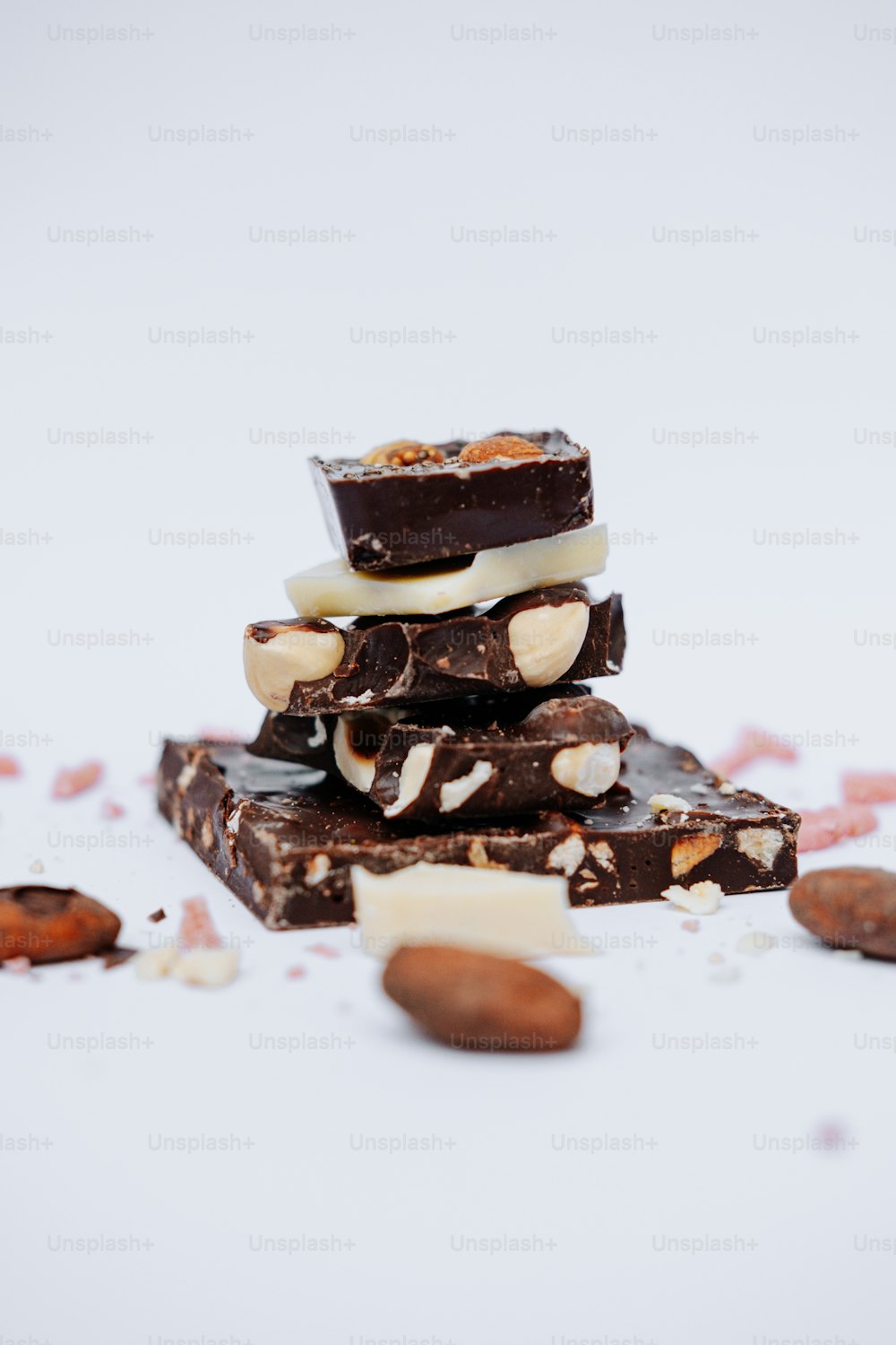 a stack of pieces of chocolate and nuts