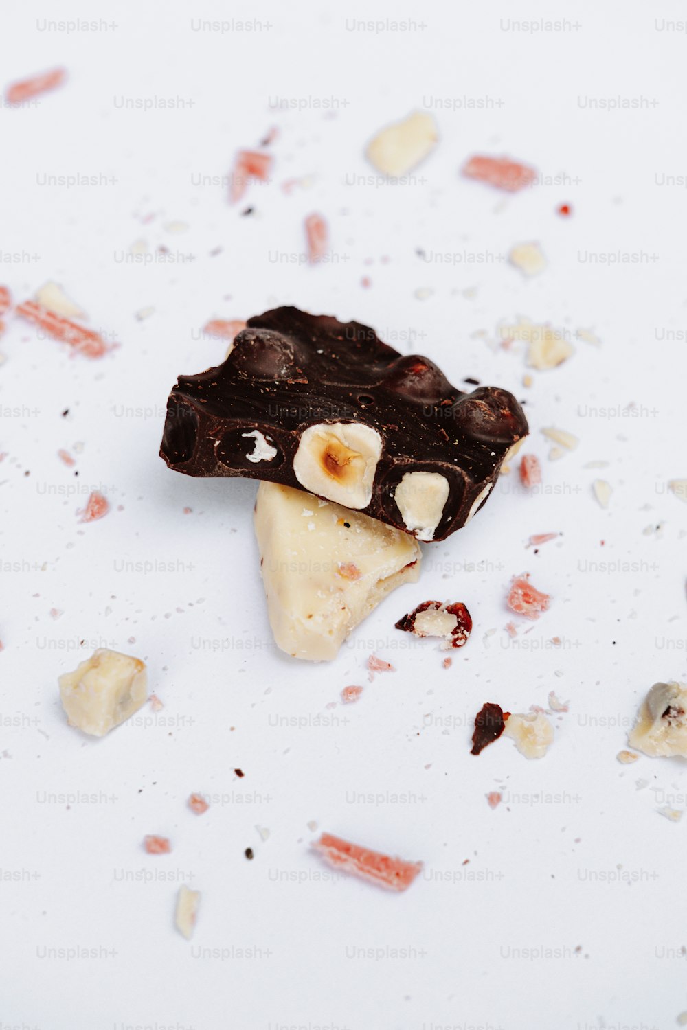 a piece of chocolate and banana dessert on a white surface