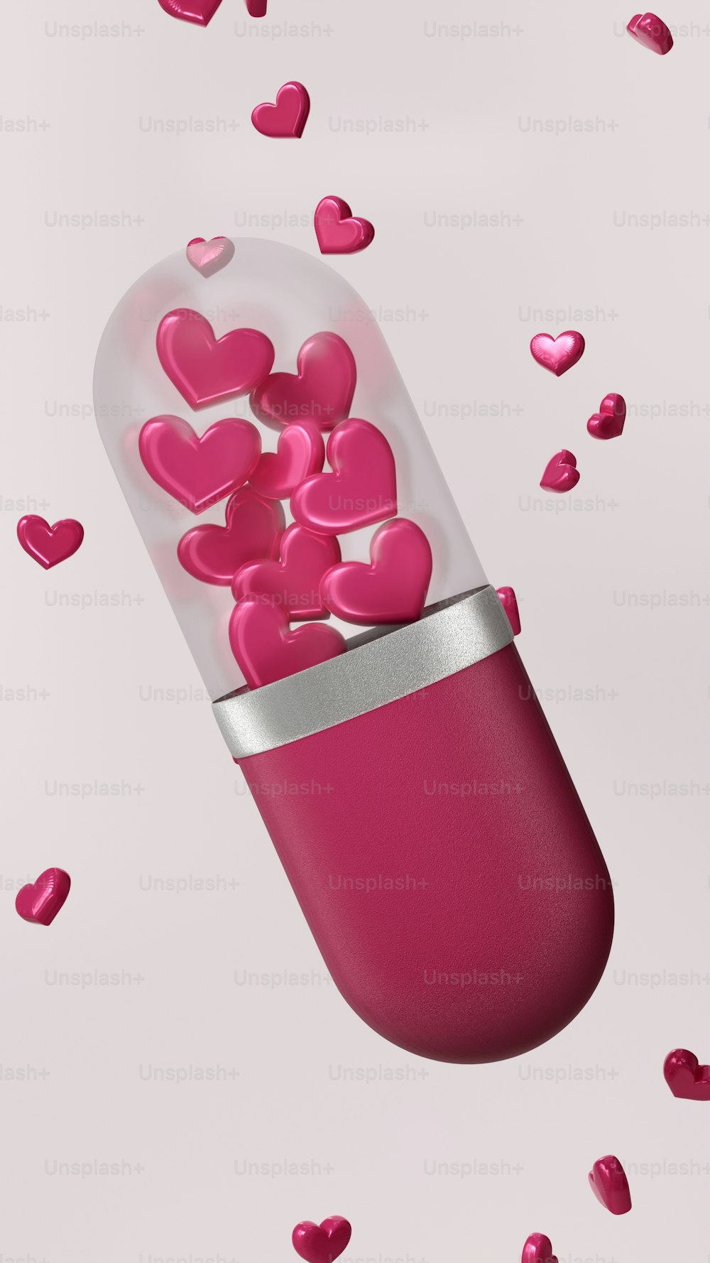 Une pilule rose remplie de cœurs roses sur fond rose