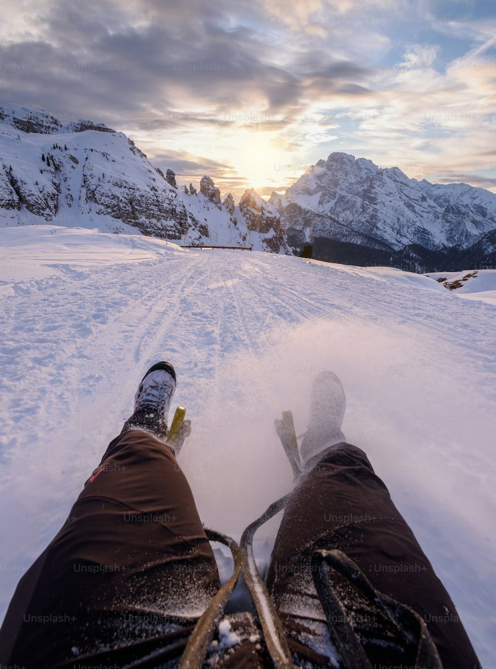 a pair of skis sitting on top of a snow covered slope