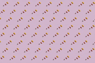 a purple background with orange and red dots