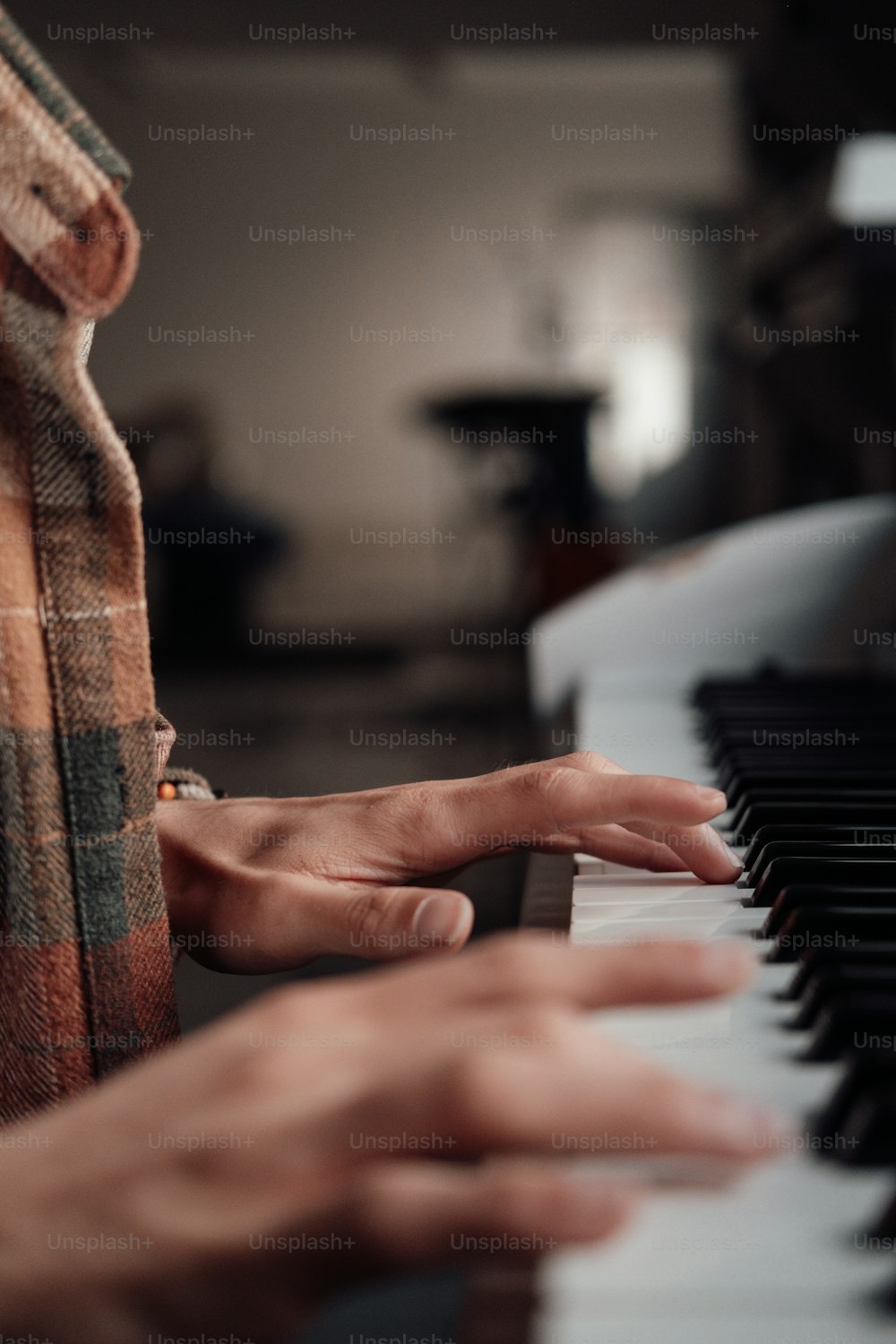 a close up of a person playing a piano