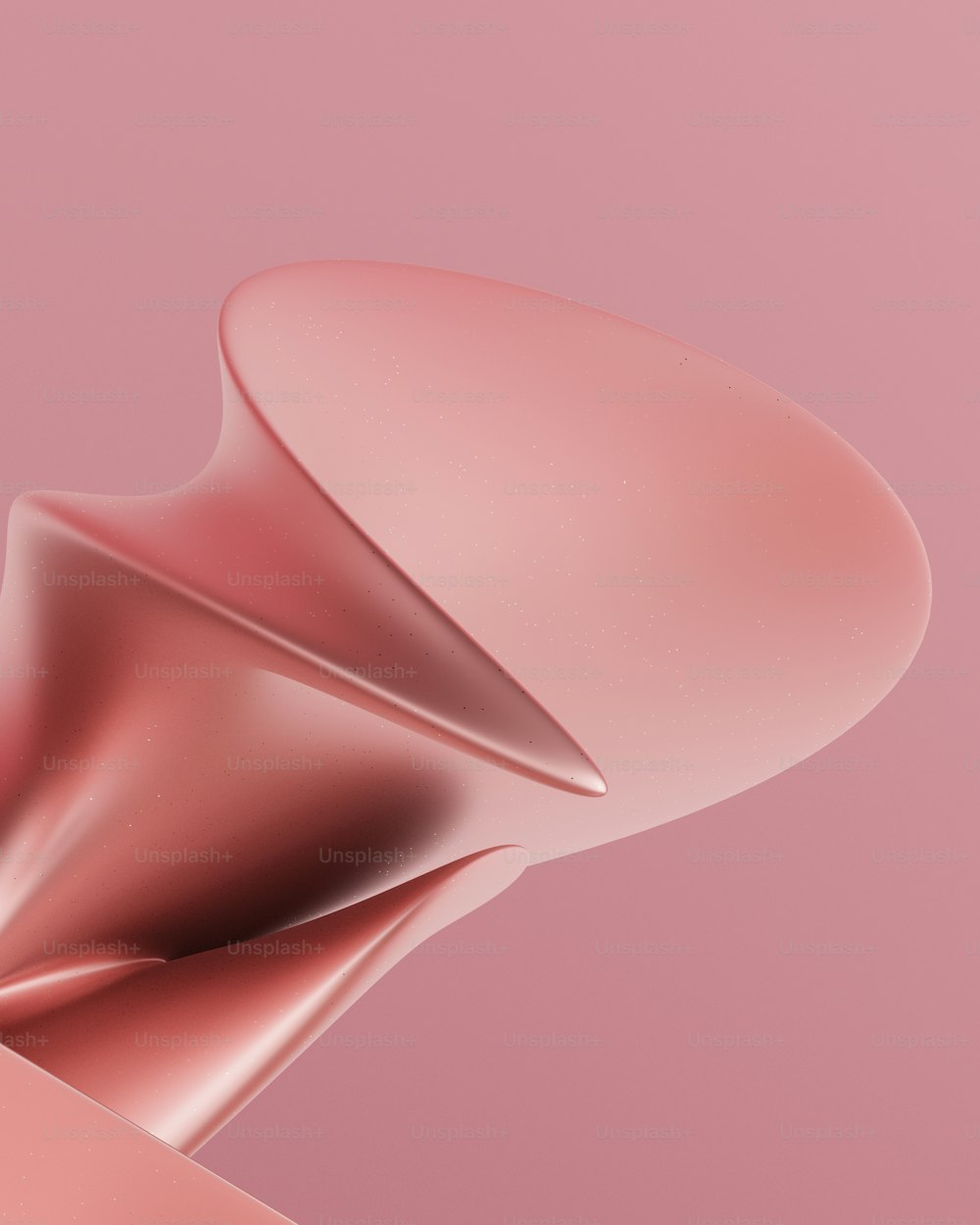 a close up of a pink object on a pink background