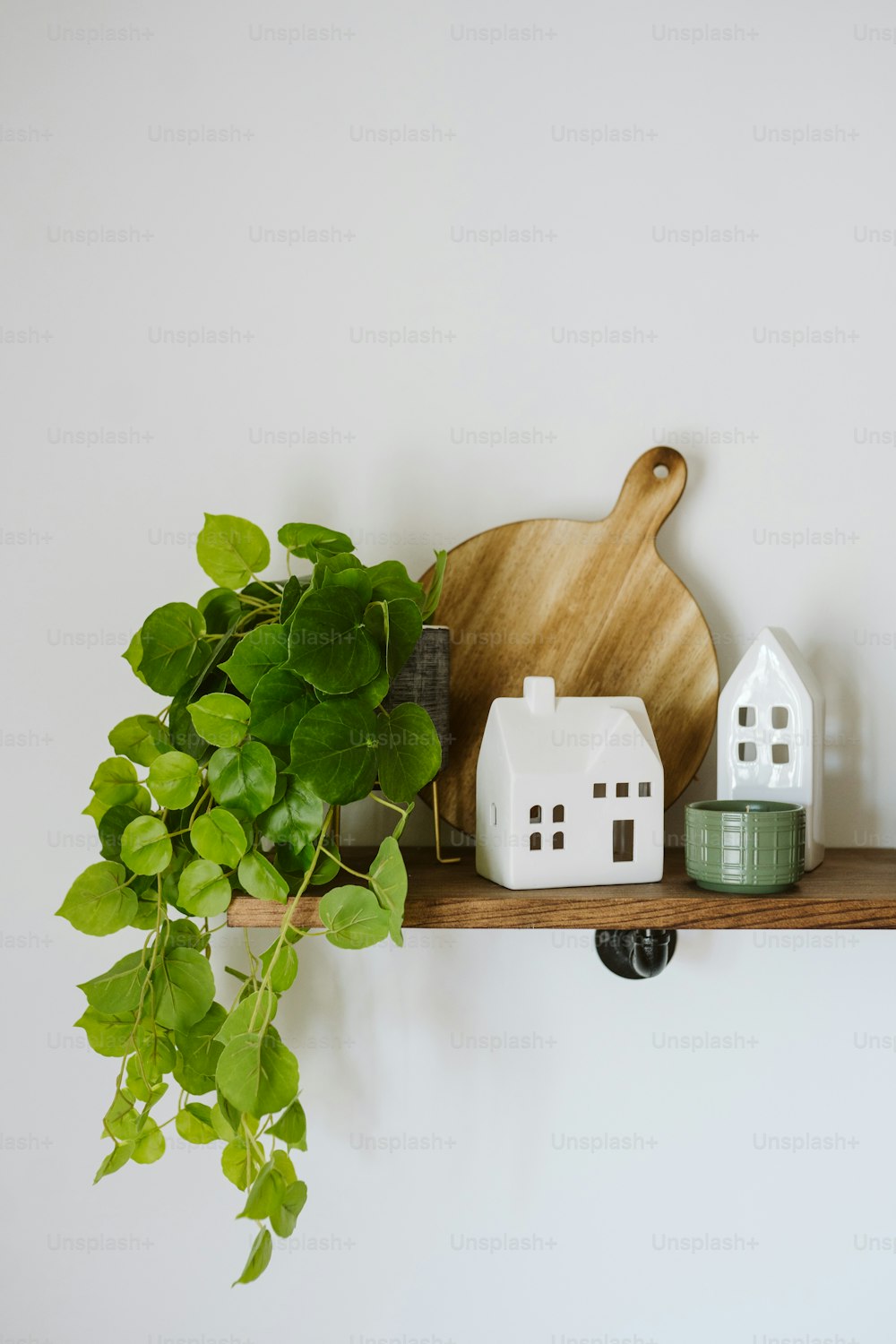 a wooden cutting board sitting on top of a shelf