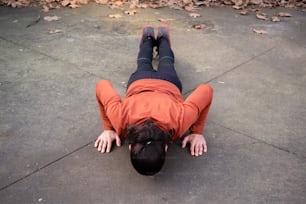 a person laying on the ground with their feet on the ground