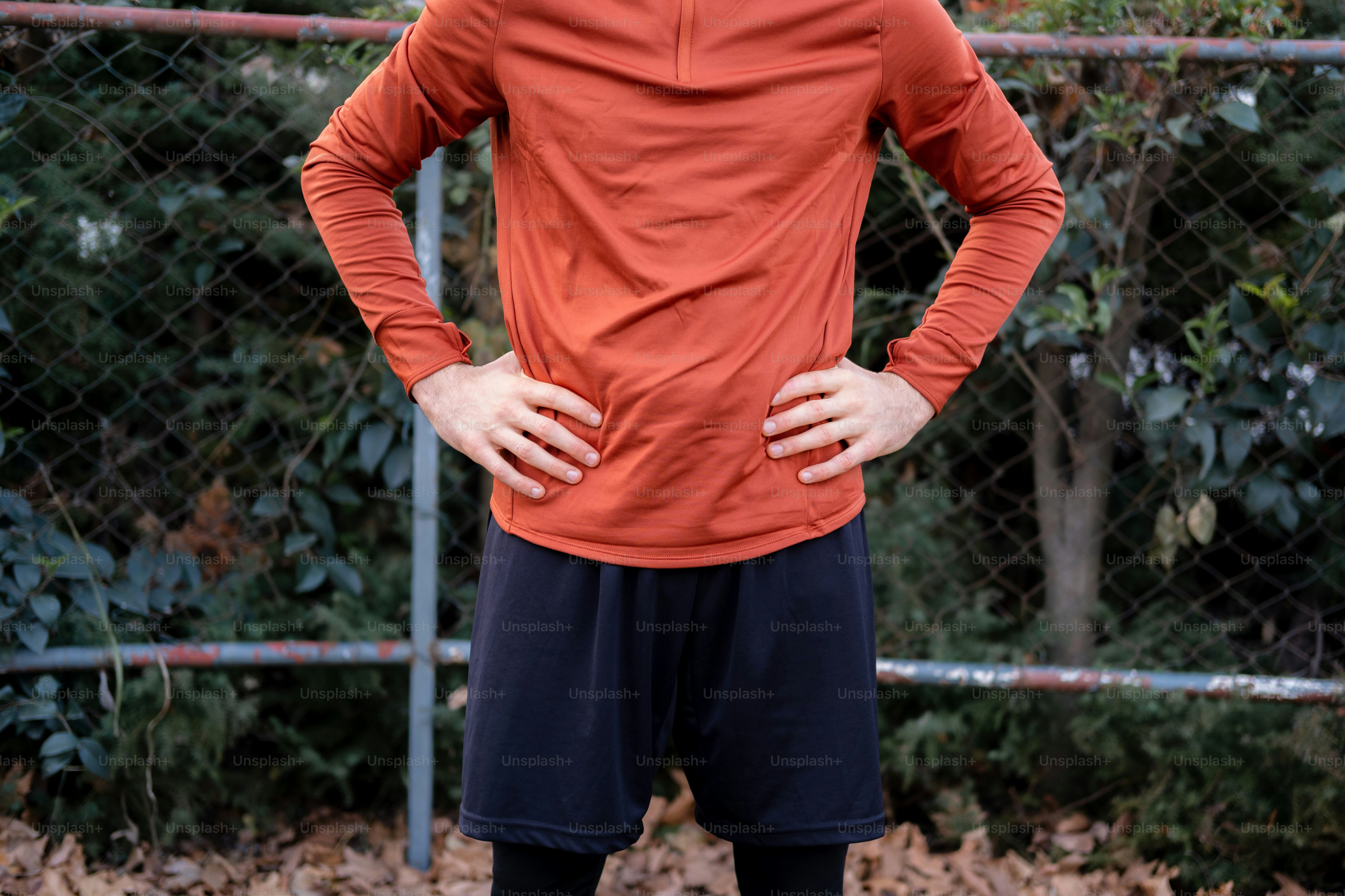 A man standing with his hands on his hips photo – Sweatshirt Image on ...