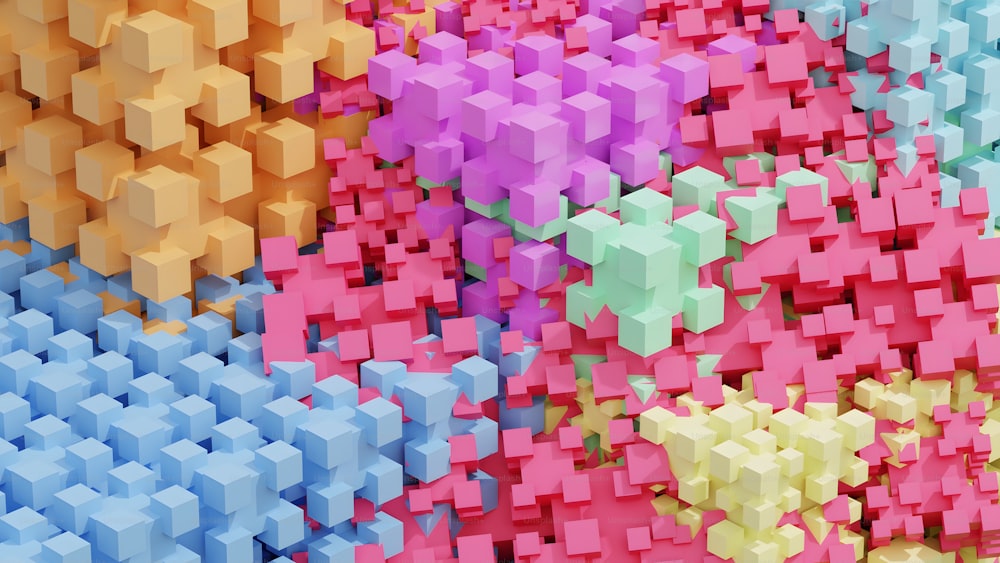 um monte de cubos de cores diferentes que estão em uma parede