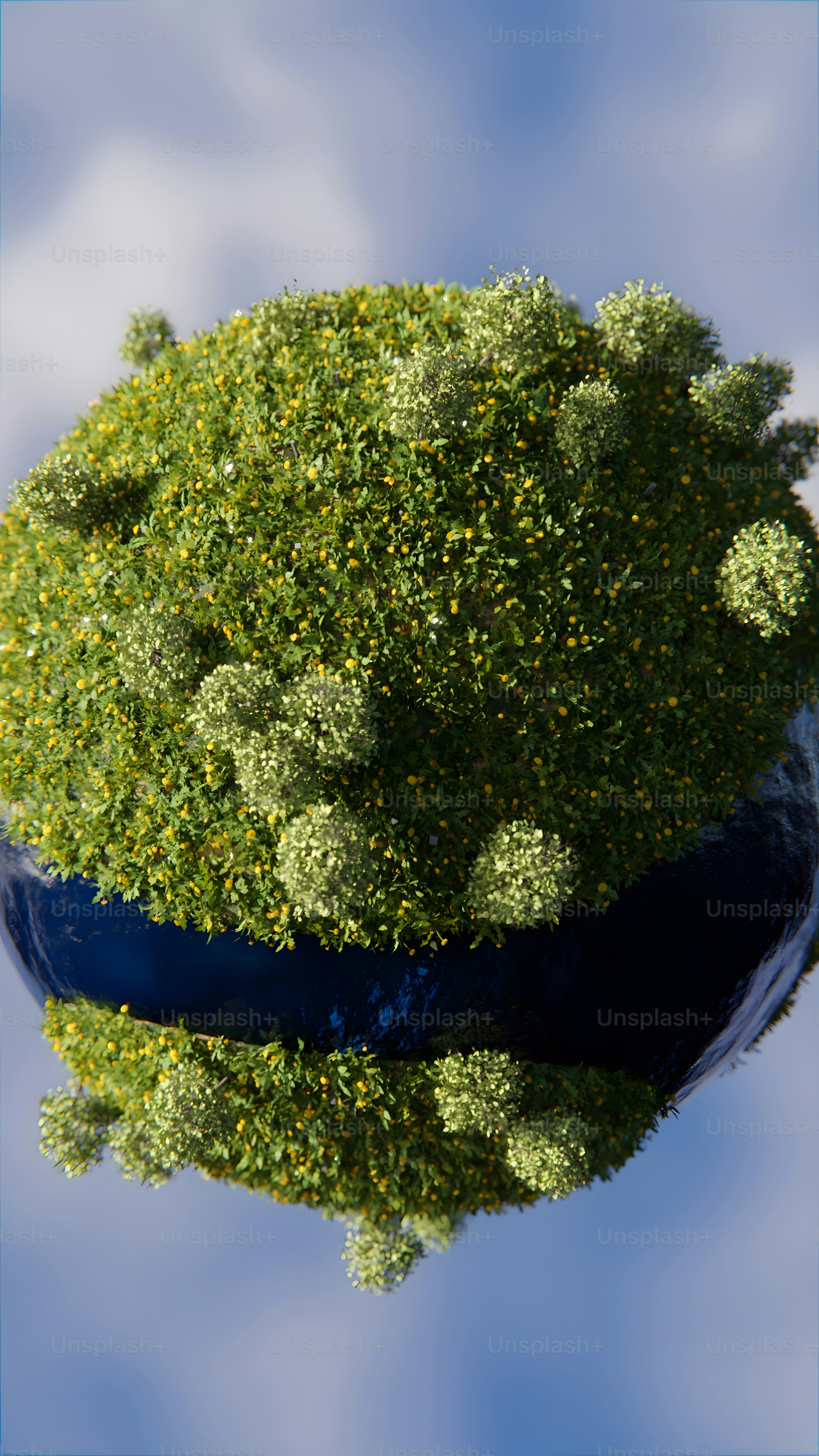 a blue vase filled with lots of green plants