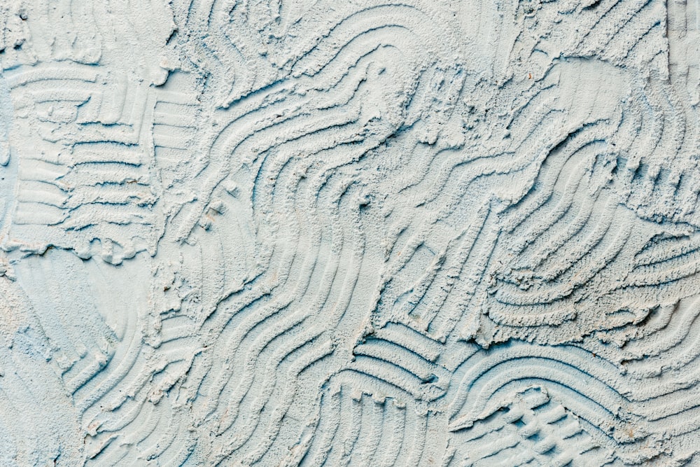 a close up of a sand design on a beach