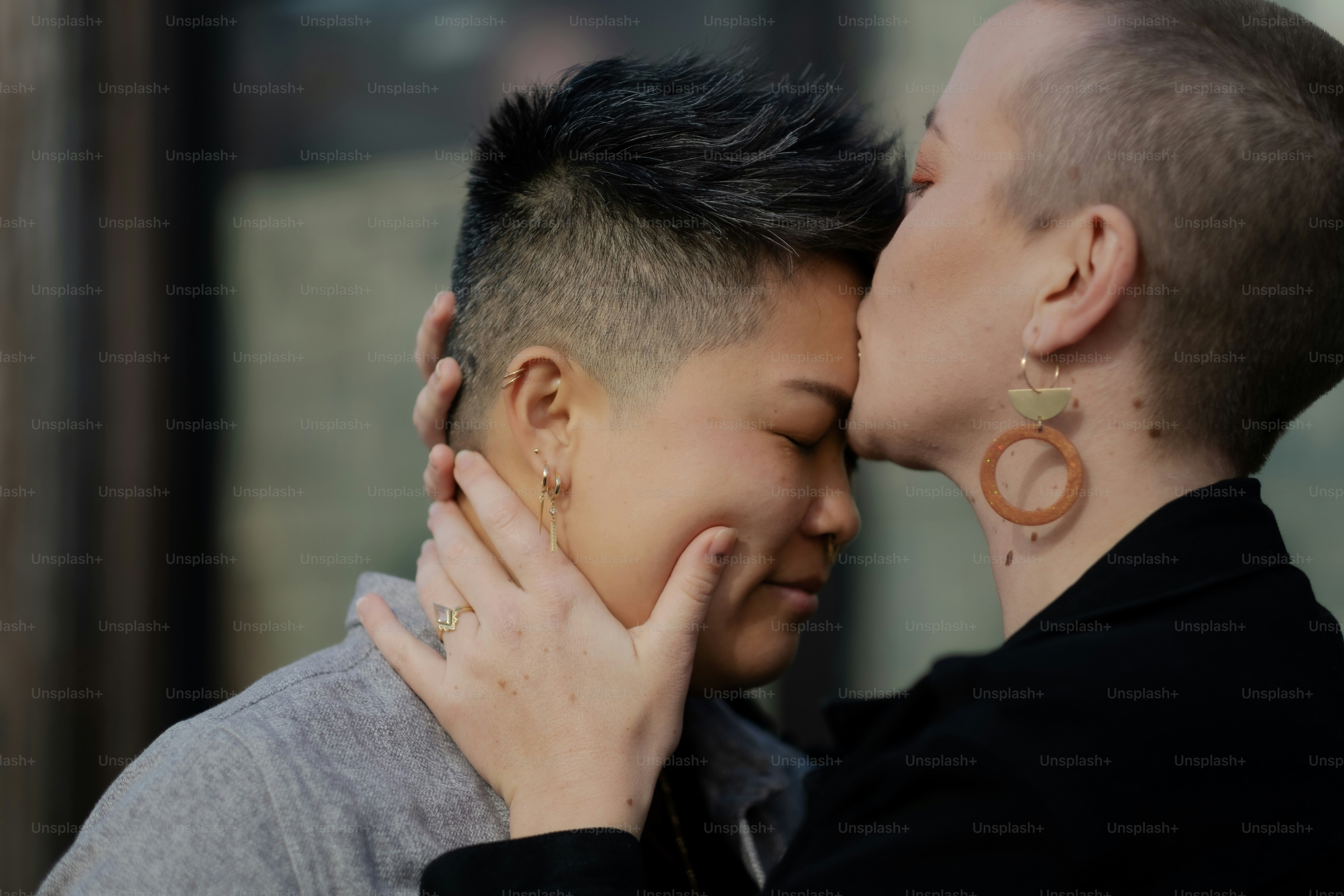 J. (they/them, Chinese American) and M. (they/them, White American), a nonbinary and interracial couple, expressing their love for each other on an outing in California.