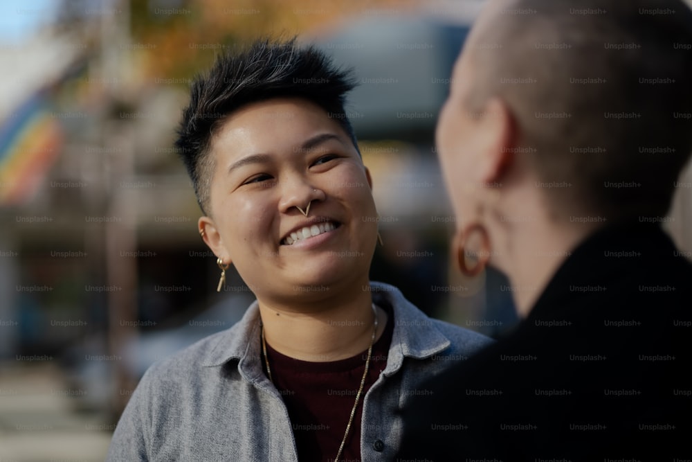 a man talking to a woman with a smile on her face