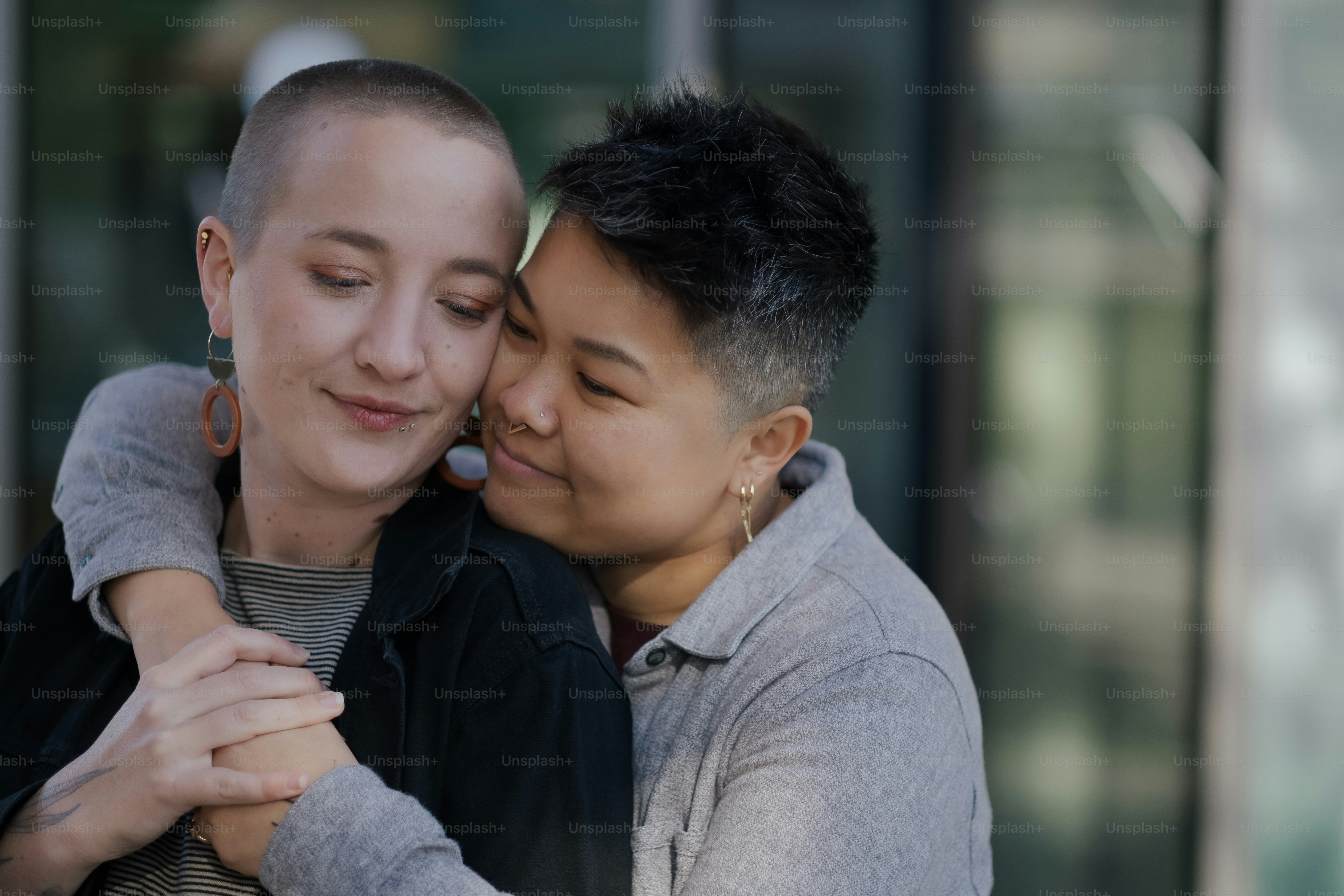 J. (they/them, Chinese American) and M. (they/them, White American), a nonbinary and interracial couple, expressing their love for each other on an outing in California.