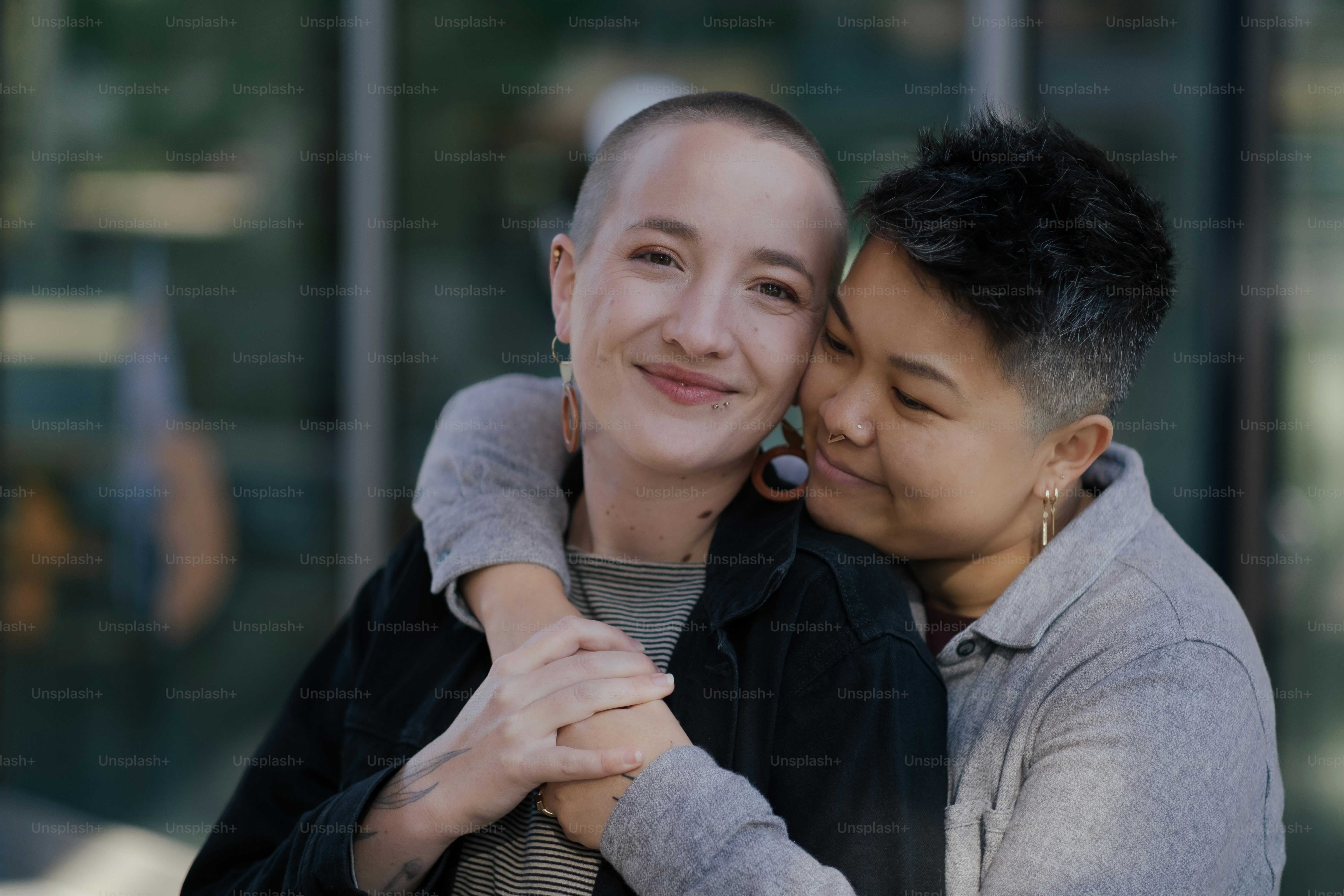 a woman hugging another woman on the cheek