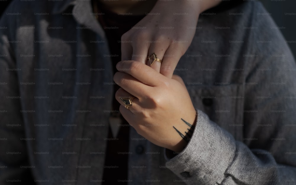 a person with a ring on their finger