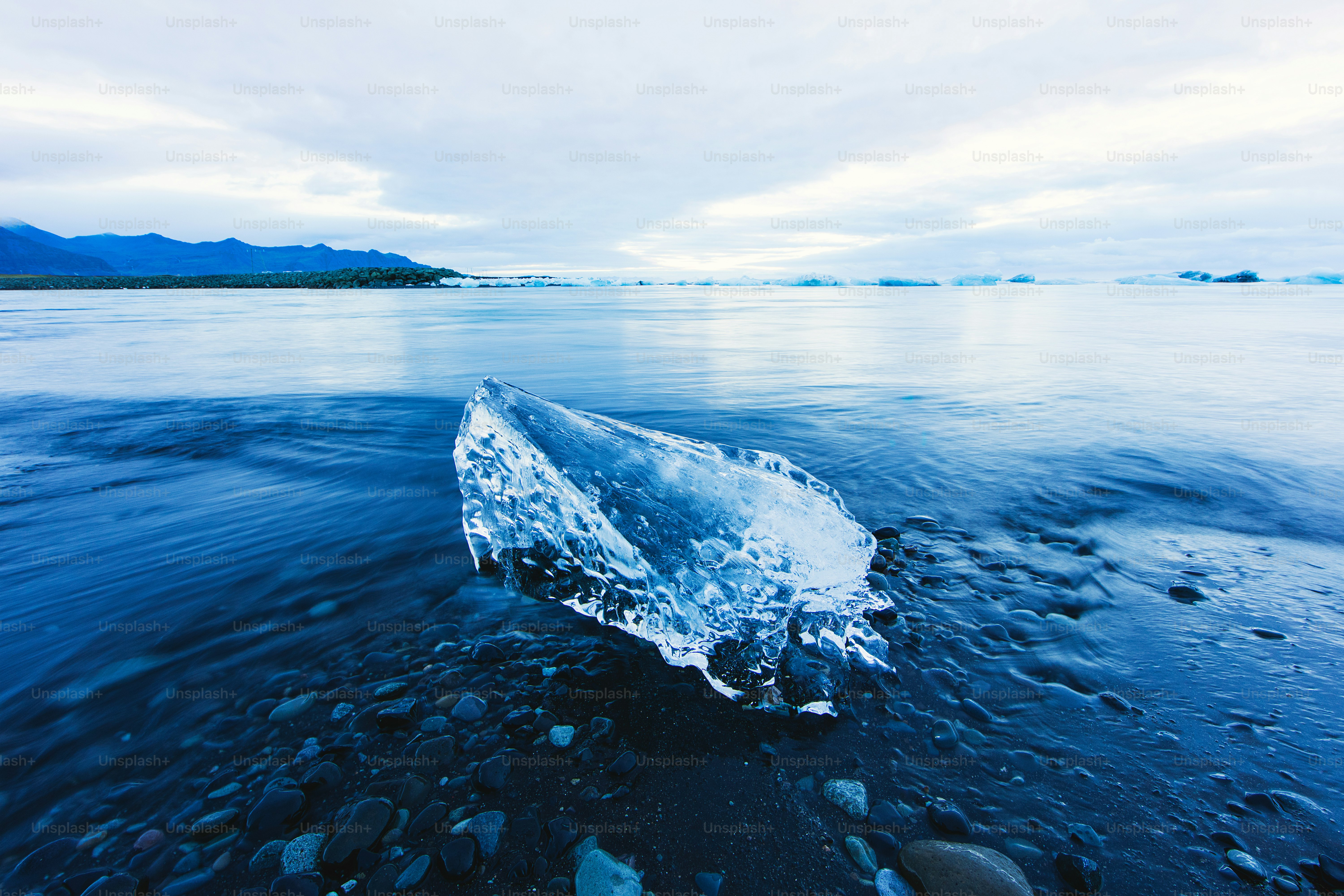 an iceberg floating on top of a body of water