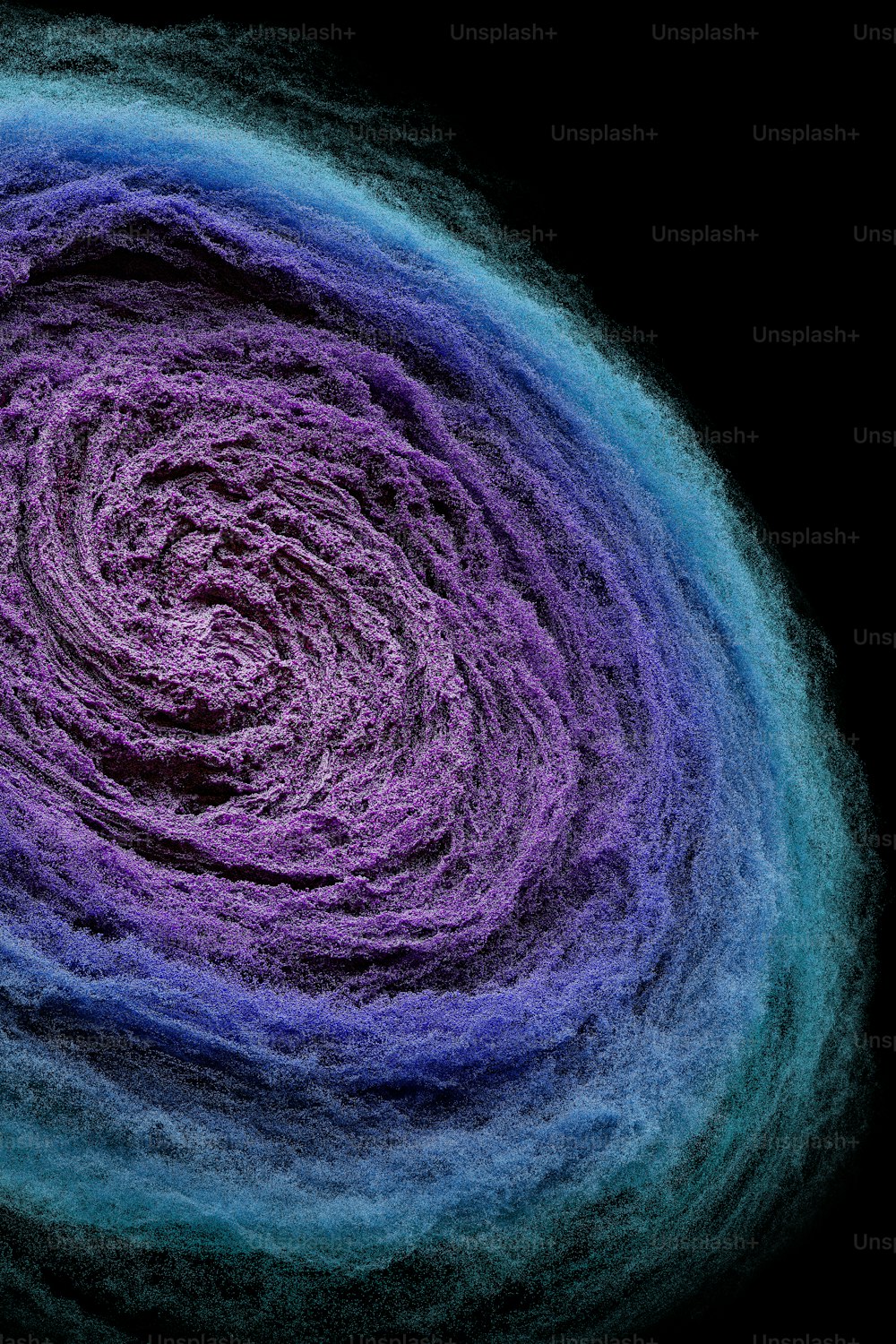 a purple and blue swirl on a black background