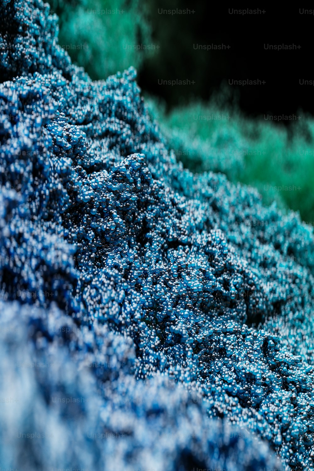 a close up of a blue and green substance