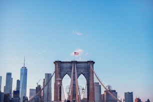 a tall bridge with a flag on top of it