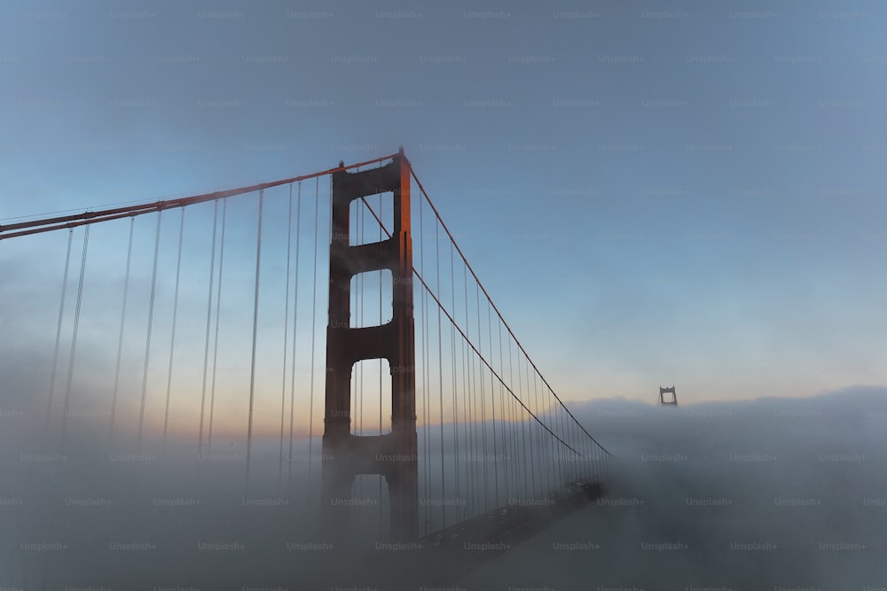 a foggy view of the golden gate bridge