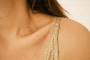 a close up of a woman wearing a bra