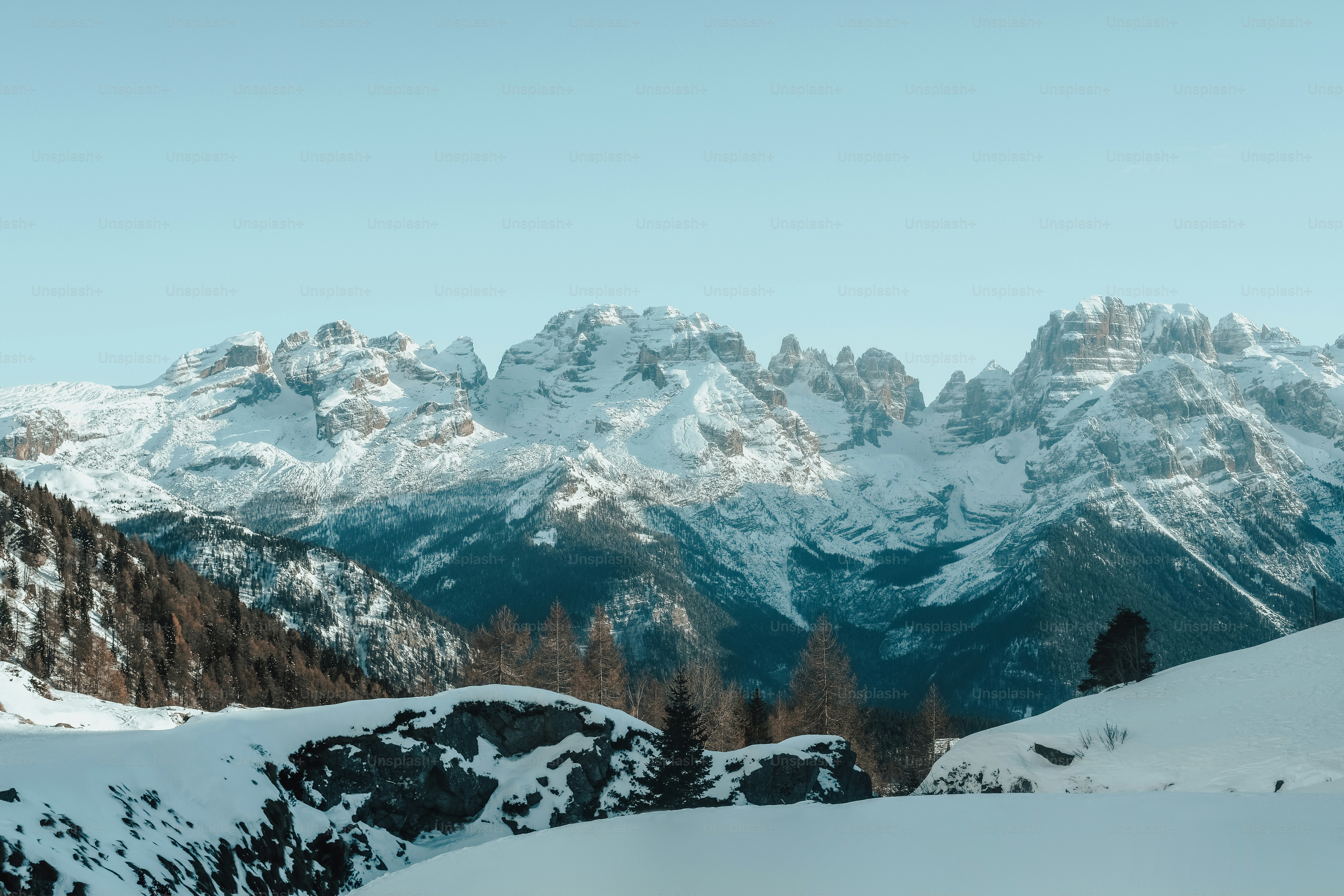a man riding skis on top of a snow covered slope