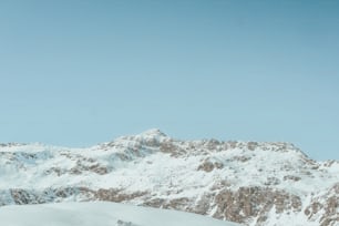 a man riding skis on top of a snow covered slope