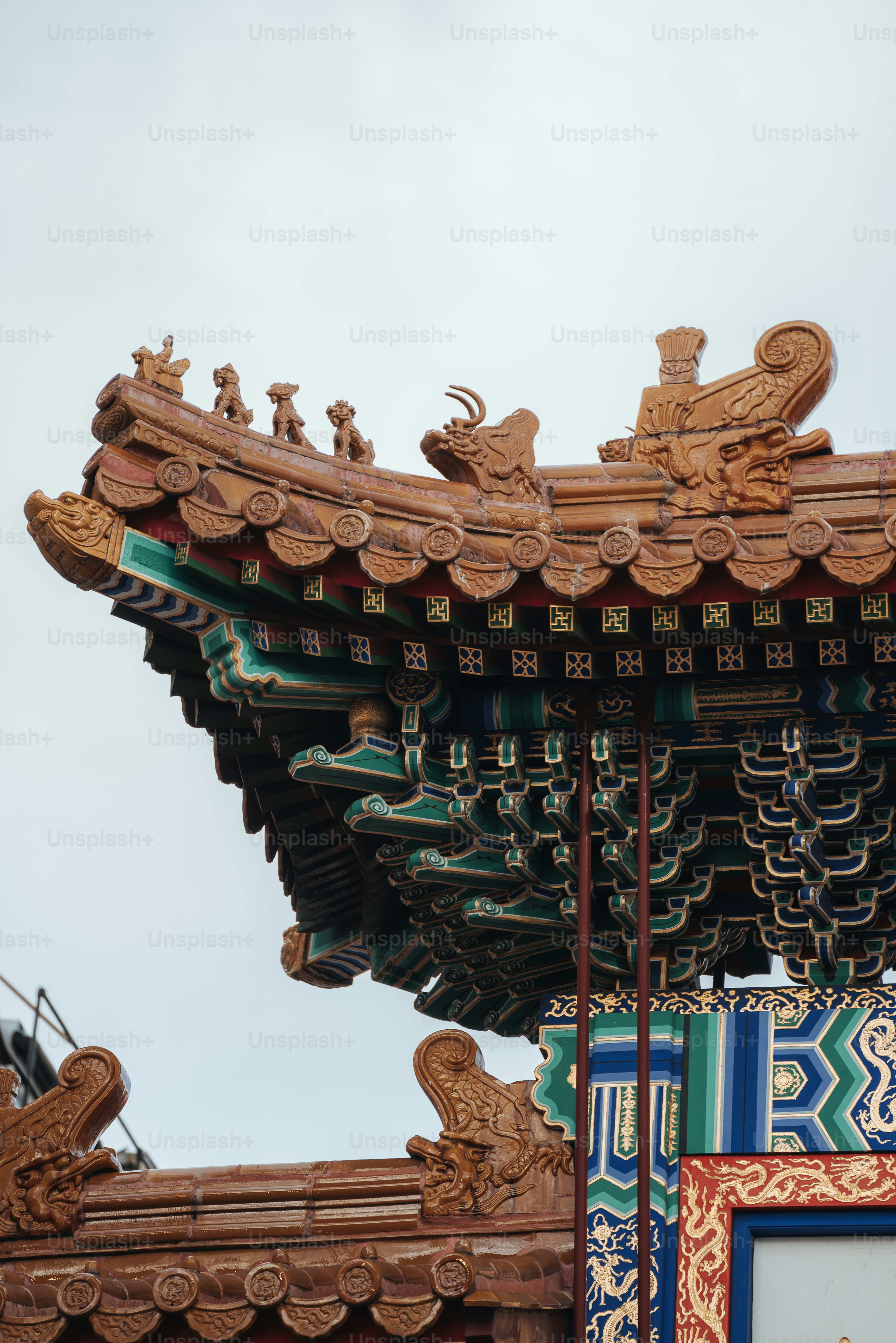 a chinese building with a clock on the top of it