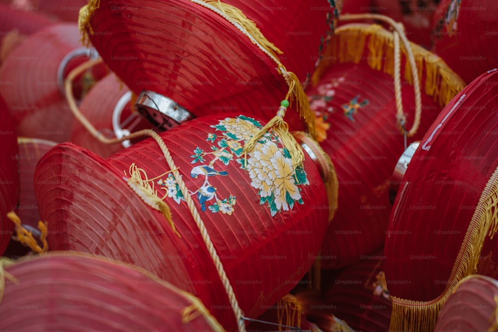 a large amount of red paper lanterns with gold trimmings
