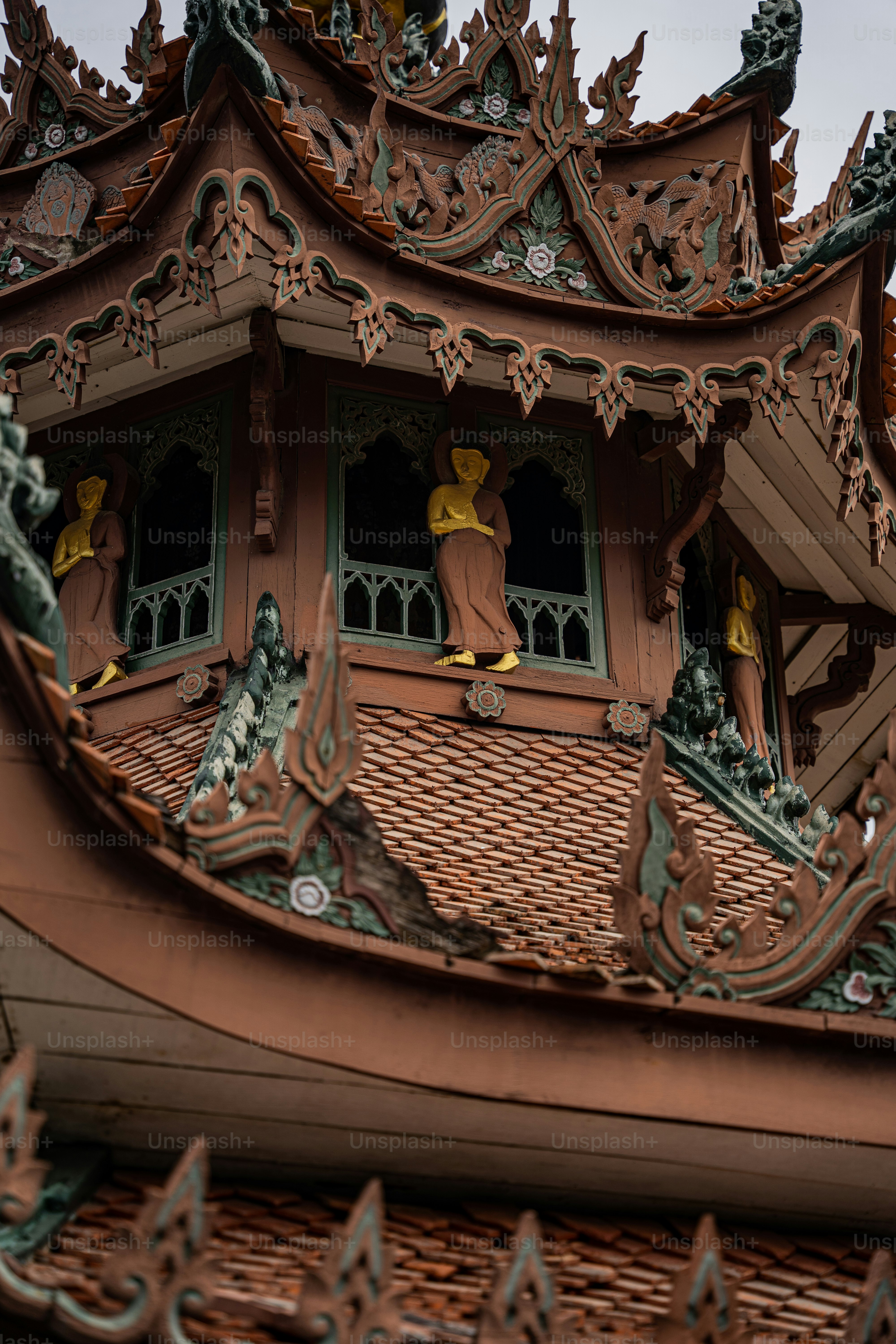 a close up of a clock tower with a sky background