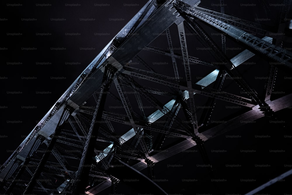 a close up of a metal structure at night
