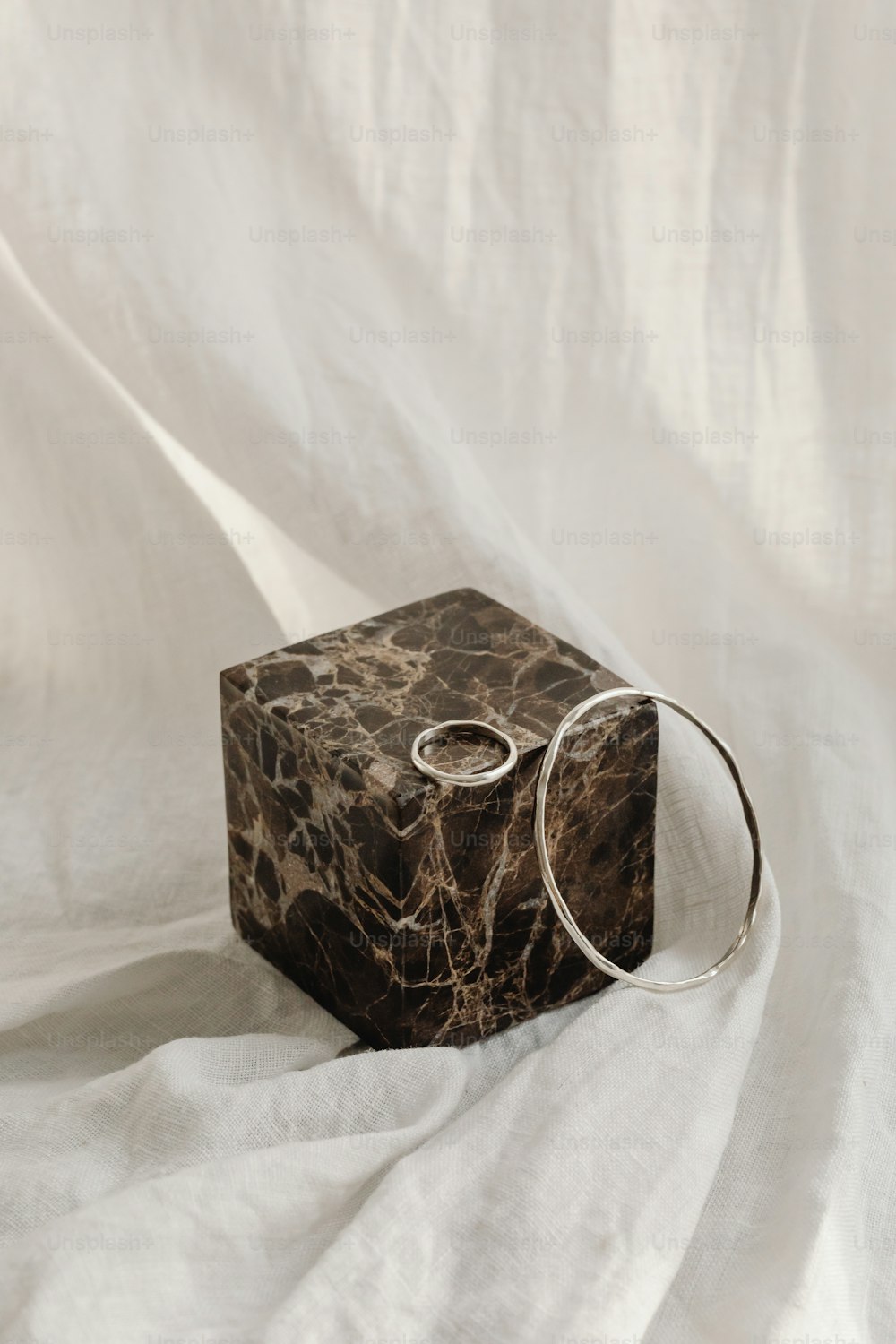 a marble block with two rings on it