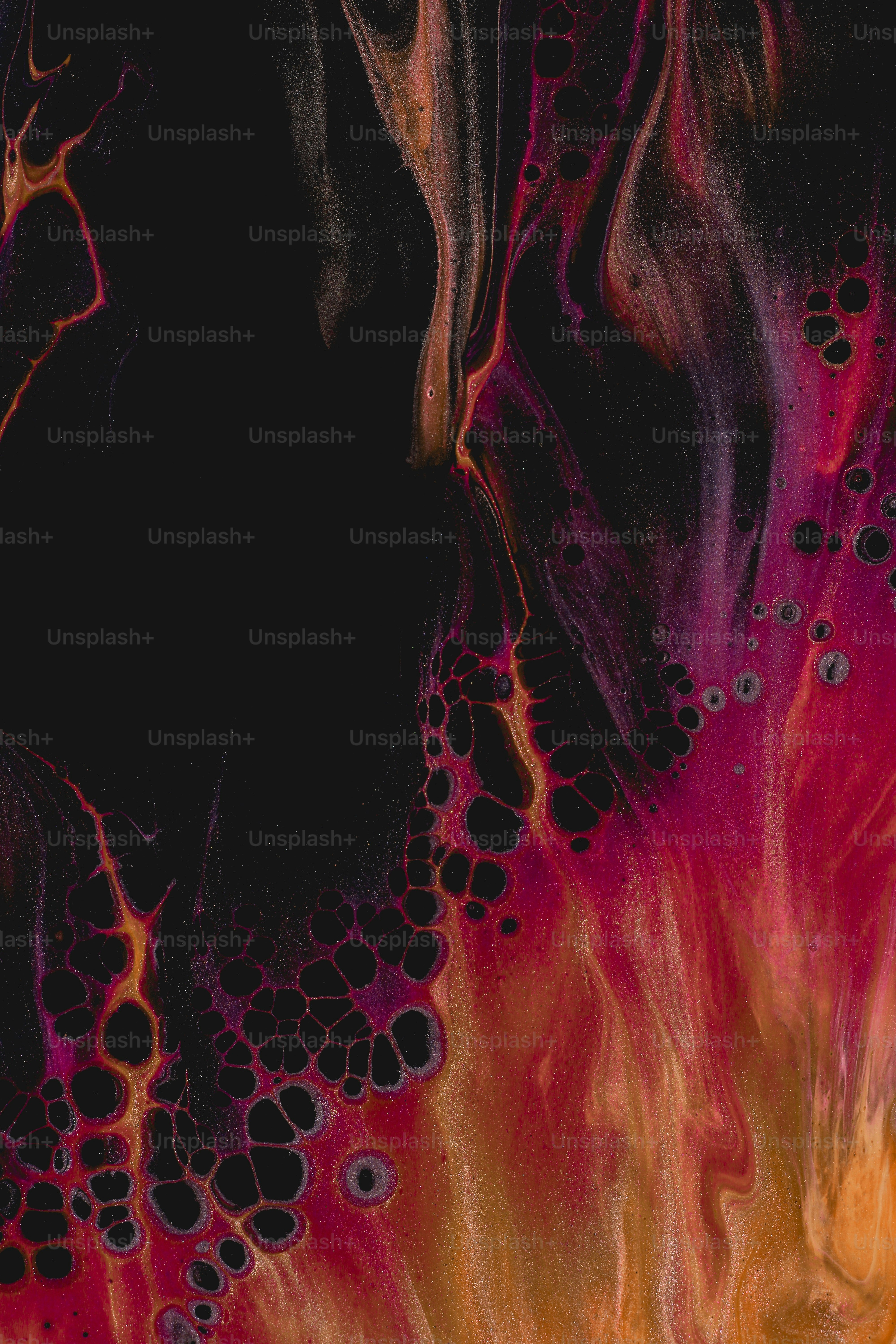 a close up of a black and red painting